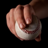 man holding baseball